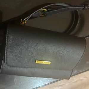 IMAN Black Pebble Leather Crossbody with Gold Accents- Has never been used.
